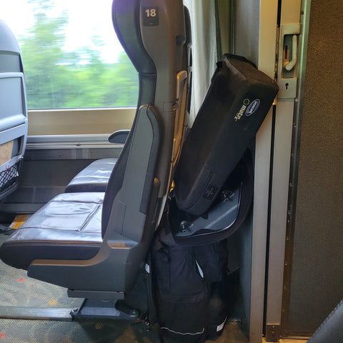 Lisa's wheelchair cushions piled on top of her backpack.