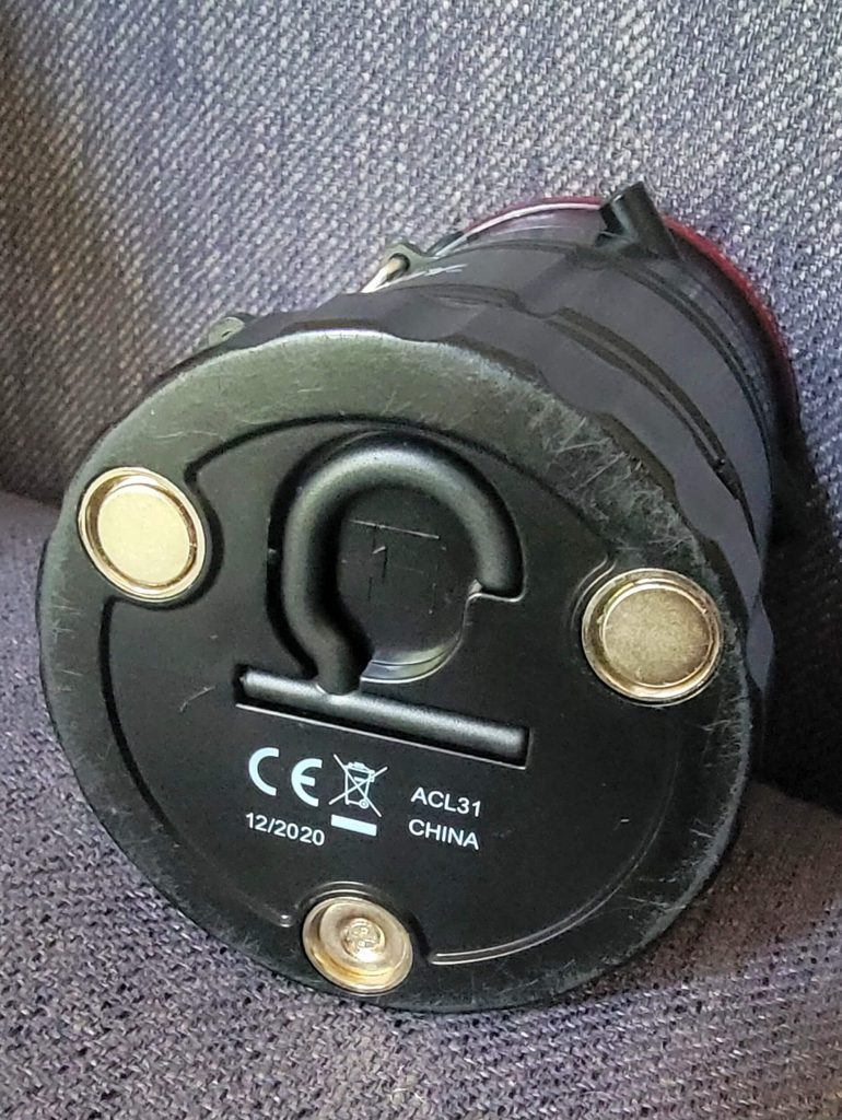 Bottom of the device (and battery compartment) closed. The hook is folded into the lantern.