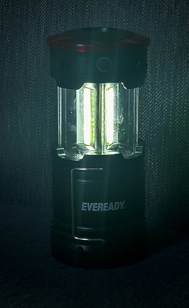 Black lantern with illuminated middle part