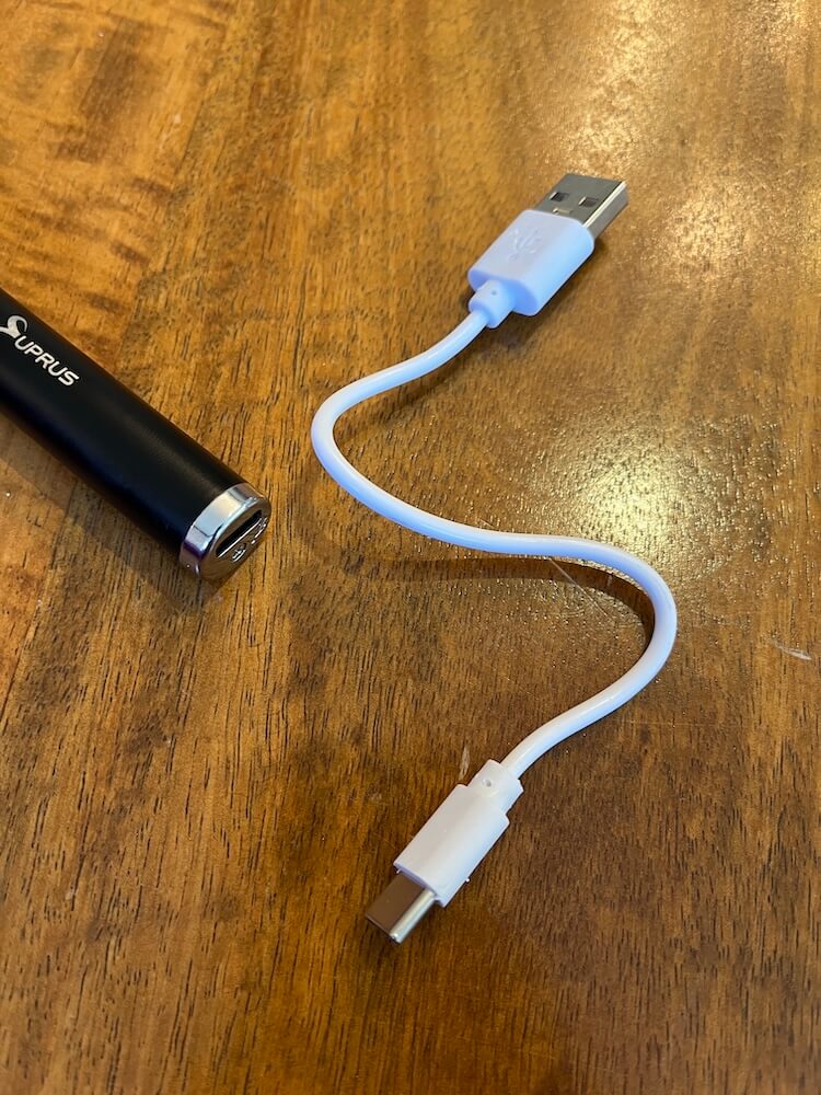 Charging port and small USB charging cord beside it