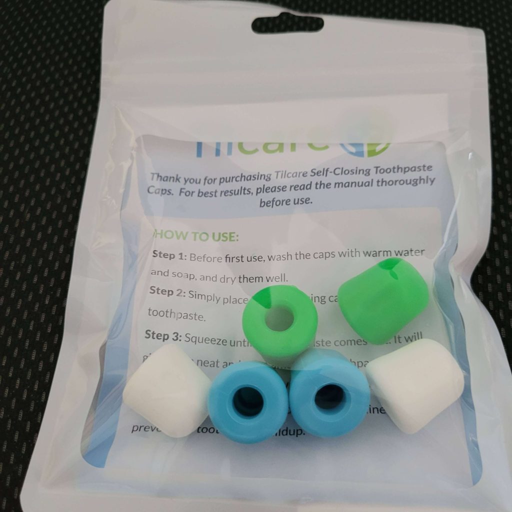 6 pack of self closing toothpaste caps by Tilcare. Two green, two blue, two white.There are instructions on "how to use" inside the pack.